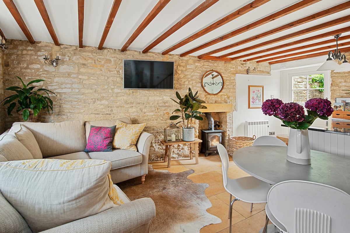 Living room with sofa and wood burner